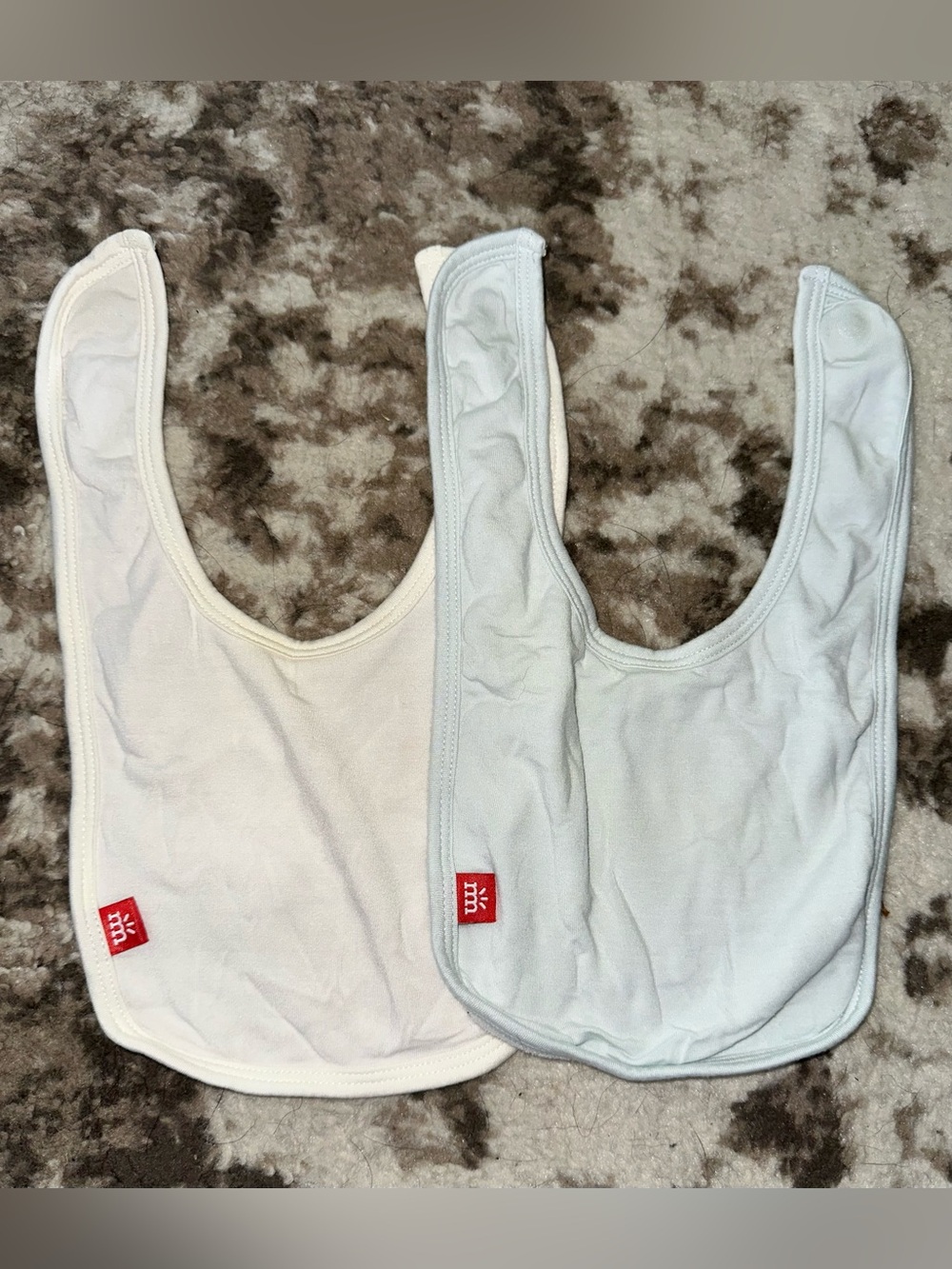 Magnetic Me White Baby Bibs with Red Logo Tag